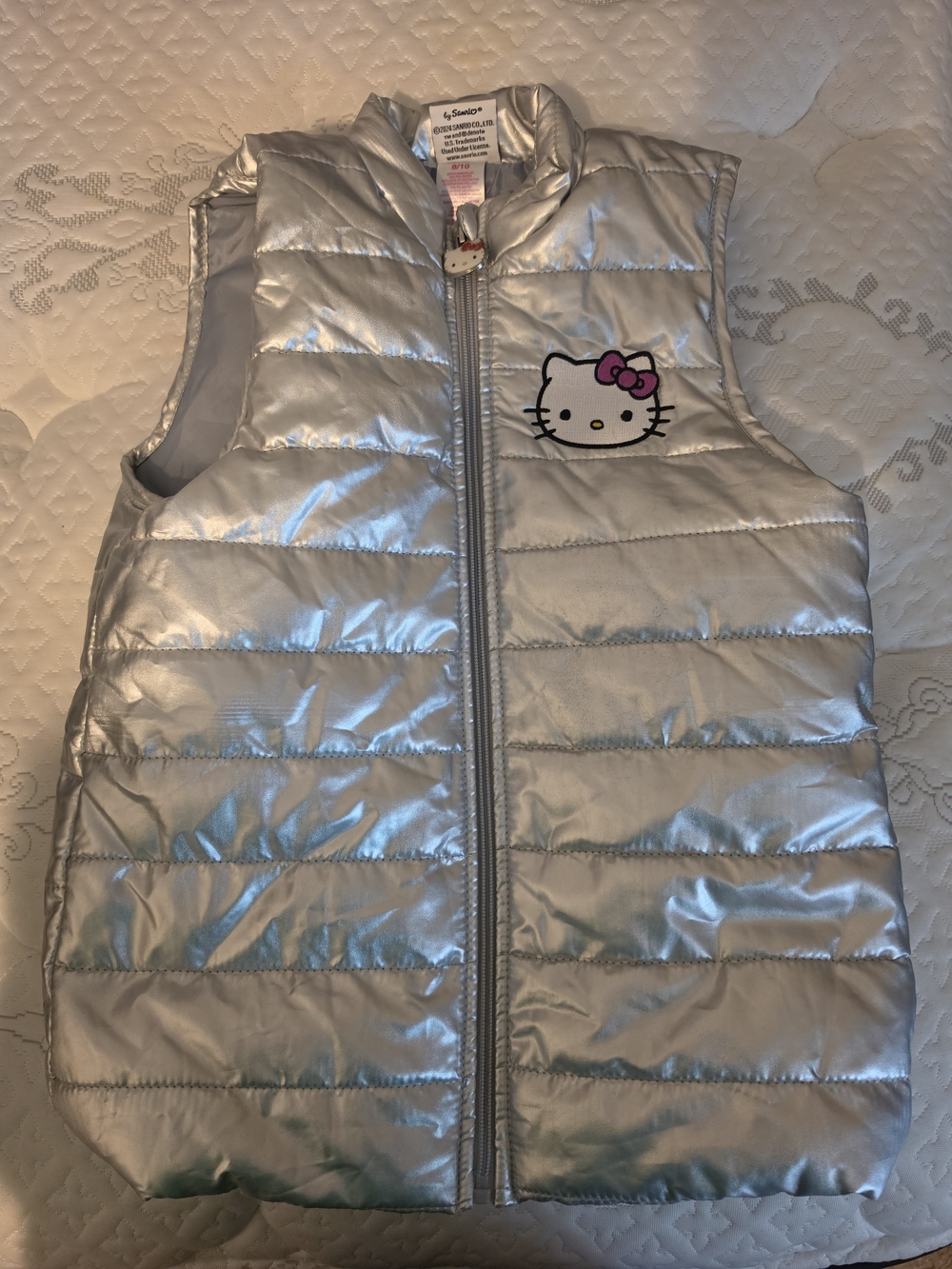 Hello Kitty Silver Puffer Vest with Pink Bow Accent 8/10